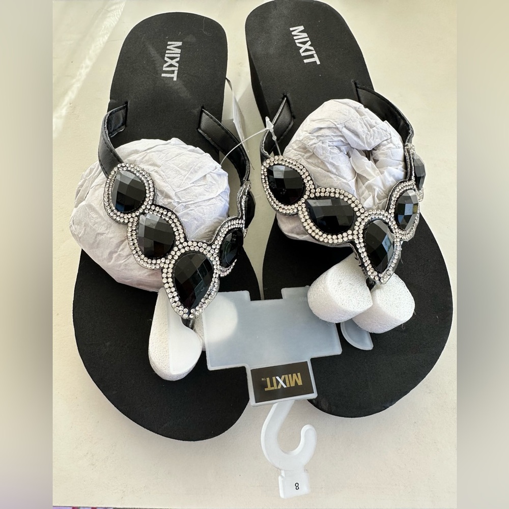 Be the party at the pool with these Mixit Bling Black Sandals with rhinestones.